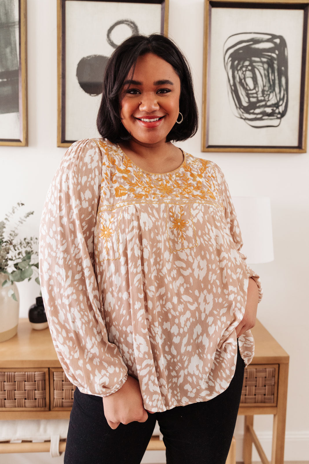 Take Me Anywhere Top featuring orange embroidery and animal print, with long balloon sleeves and elastic cuffs.