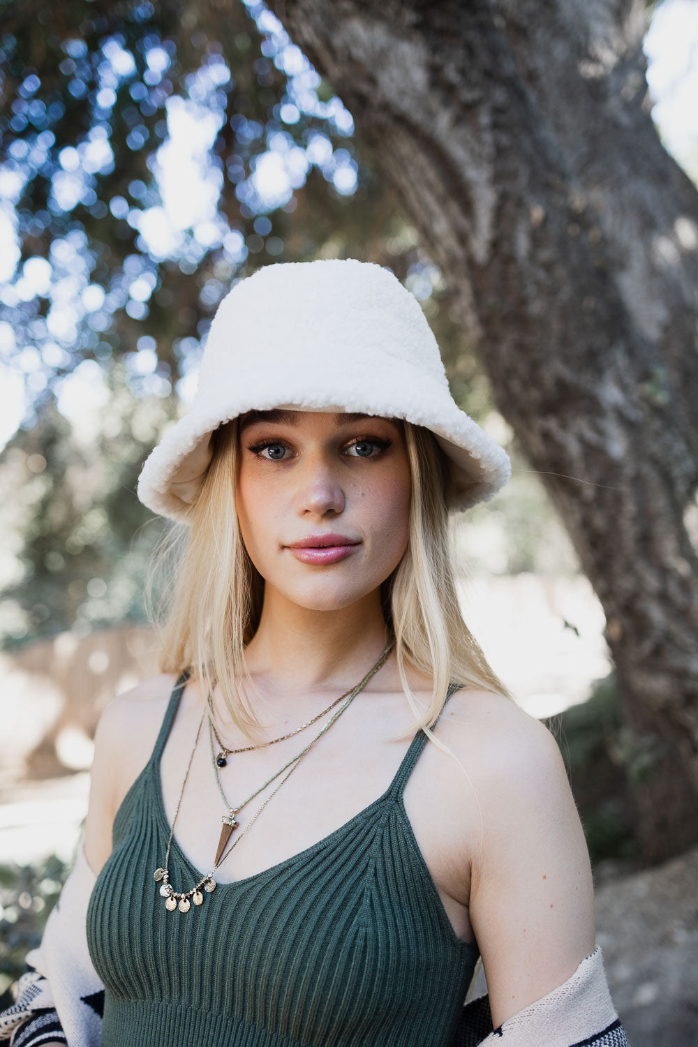 Teddy Suede Combo Reversible Bucket Hat in cozy teddy suede material, showcasing its stylish and versatile design.