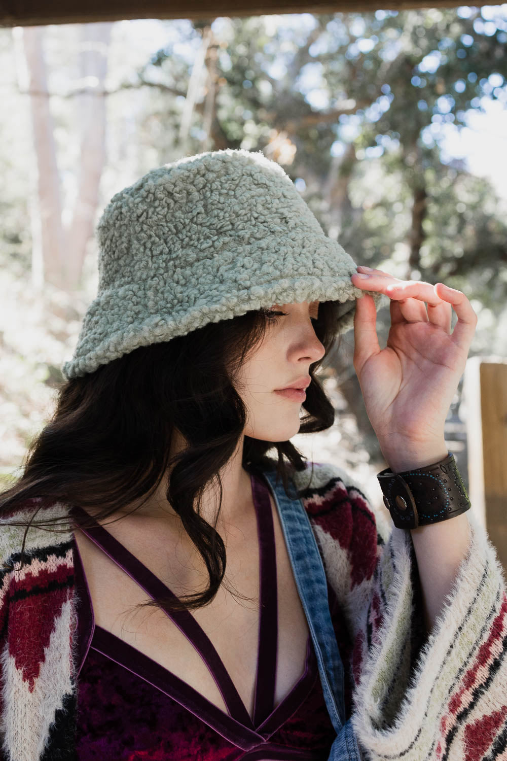 Teddy Suede Combo Reversible Bucket Hat in cozy teddy suede material, showcasing its stylish and versatile design.