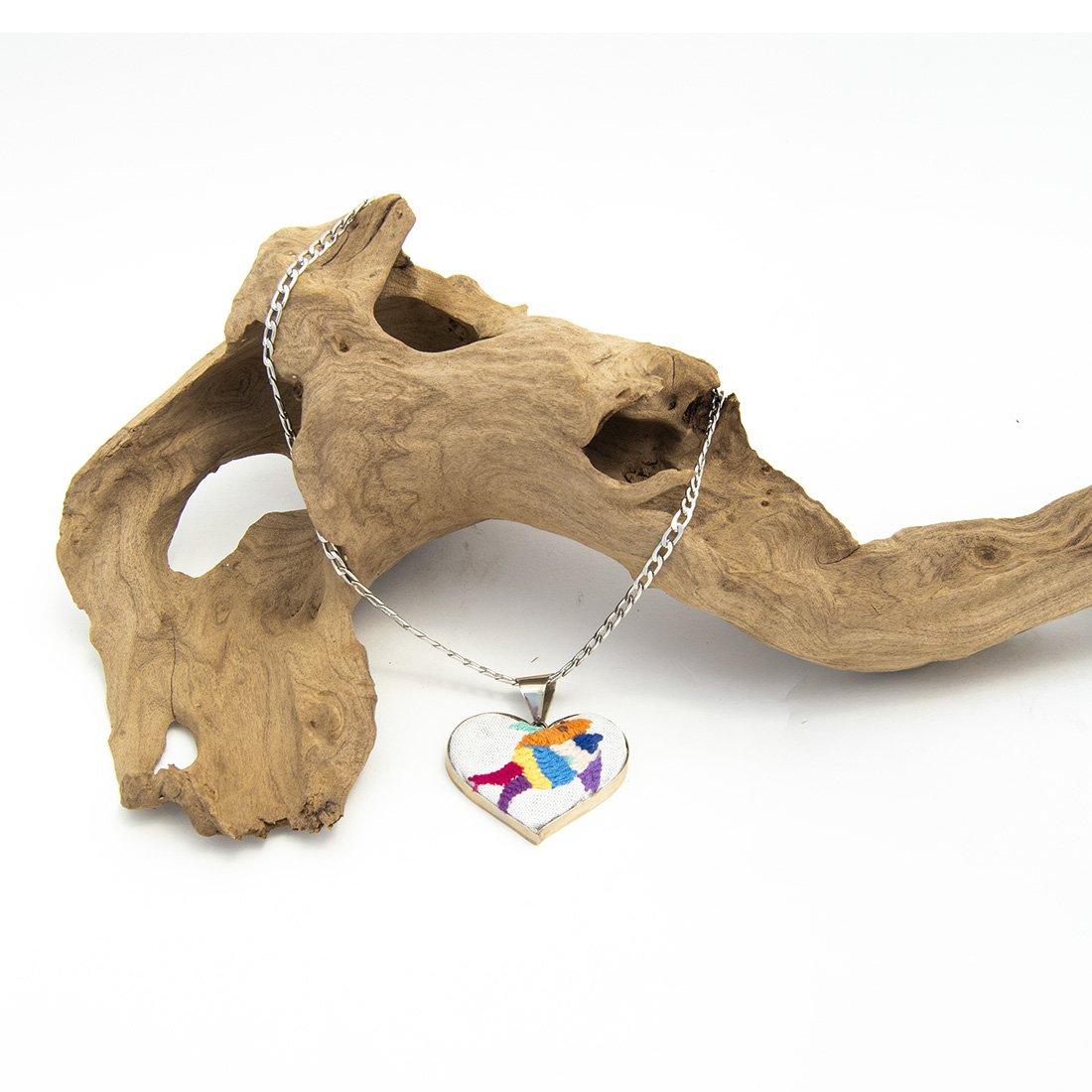 Colorful Tenango de Doria Embroidered Heart Necklace with unique Otomi embroidery on aluminum pendant.