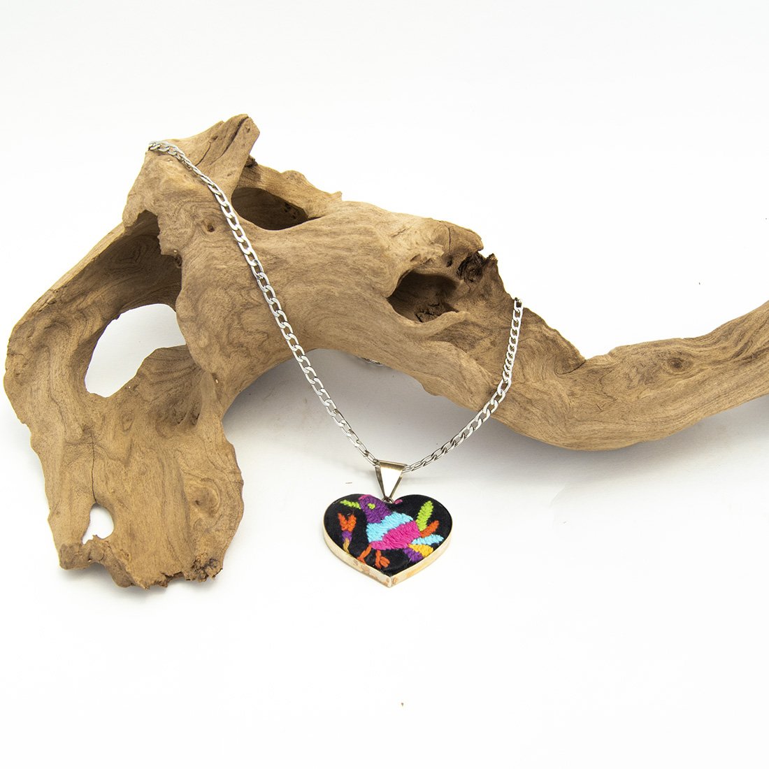 Colorful Tenango de Doria Embroidered Heart Necklace with unique Otomi embroidery on aluminum pendant.
