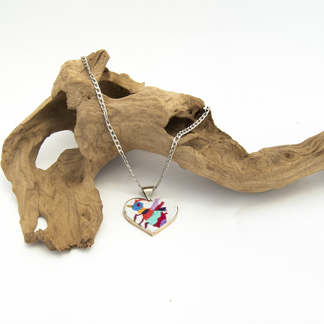 Colorful Tenango de Doria Embroidered Heart Necklace with unique Otomi embroidery on aluminum pendant.