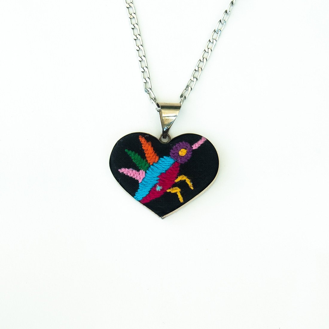 Colorful Tenango de Doria Embroidered Heart Necklace with unique Otomi embroidery on aluminum pendant.