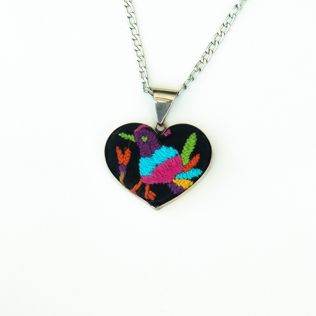 Colorful Tenango de Doria Embroidered Heart Necklace with unique Otomi embroidery on aluminum pendant.