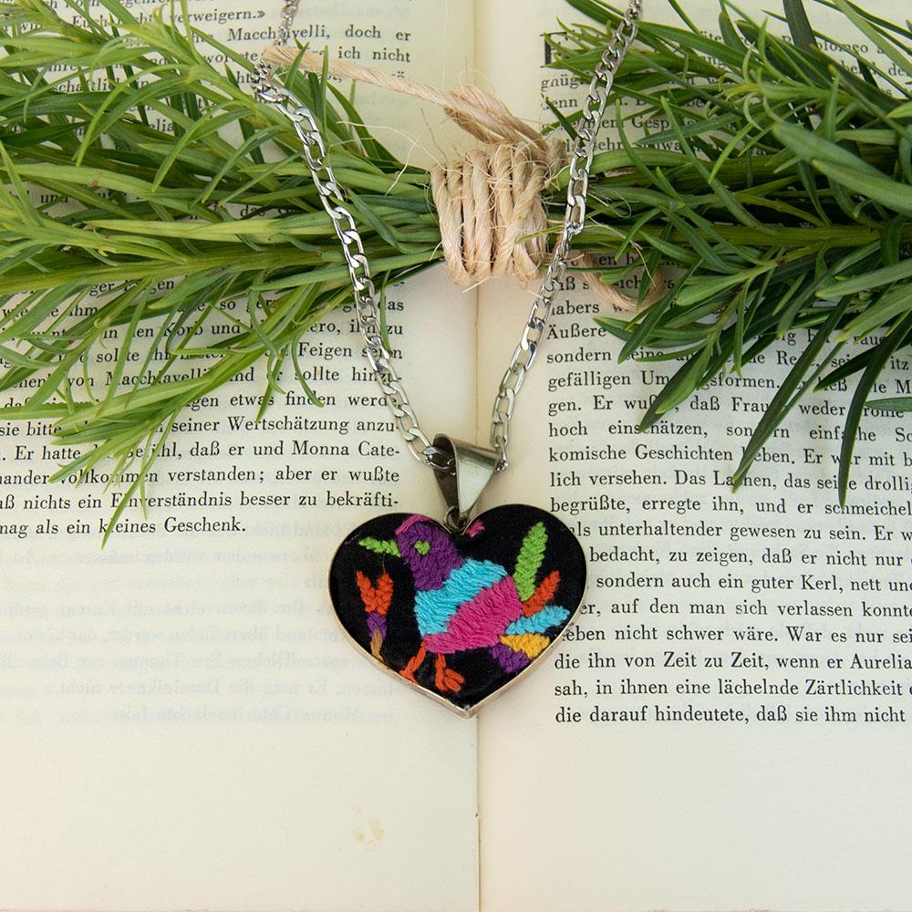 Colorful Tenango de Doria Embroidered Heart Necklace with unique Otomi embroidery on aluminum pendant.
