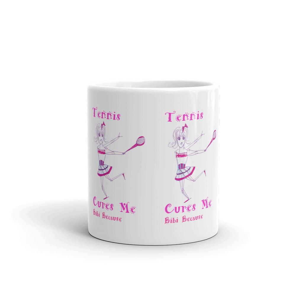 A glossy white ceramic mug with the phrase 'Tennis Cures Me' printed in vibrant colors, perfect for coffee or tea.
