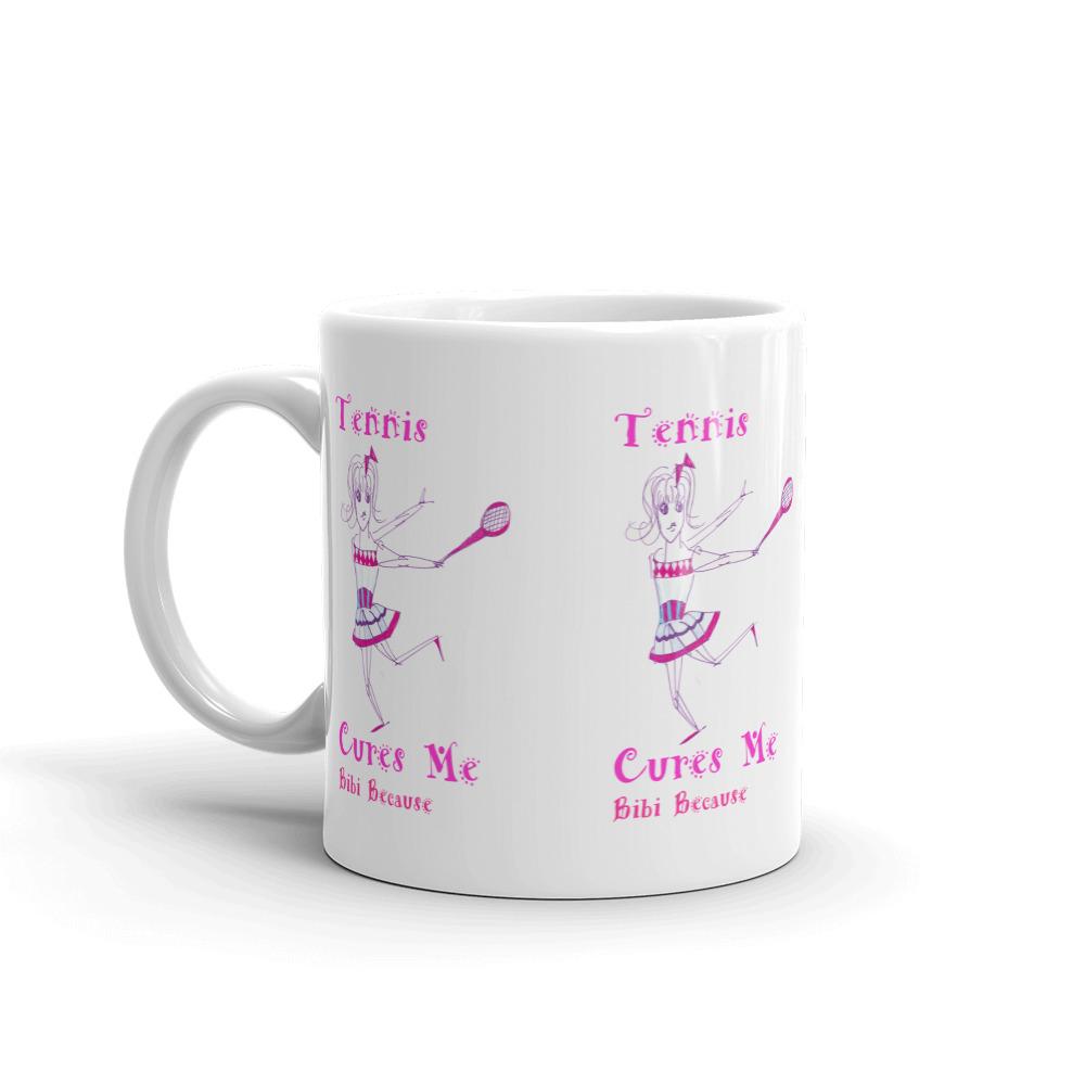 A glossy white ceramic mug with the phrase 'Tennis Cures Me' printed in vibrant colors, perfect for coffee or tea.