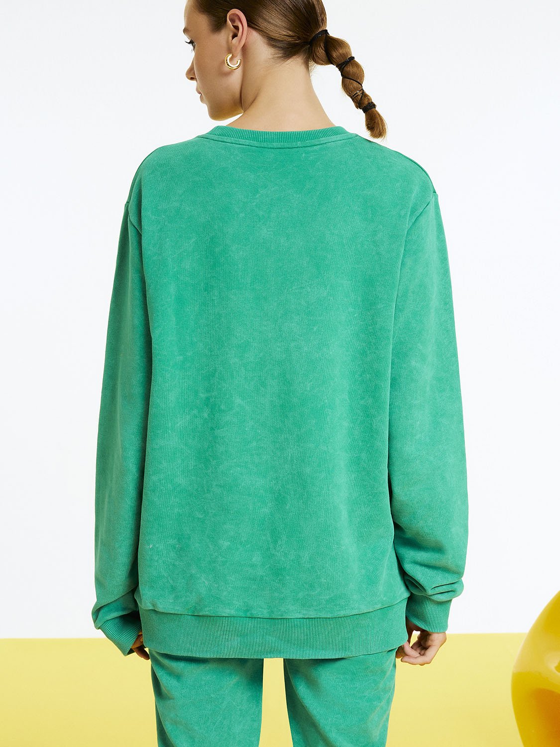 Text Print Oversized Sweatshirt featuring a crew-neck design and long sleeves with a stylish front text print detail.