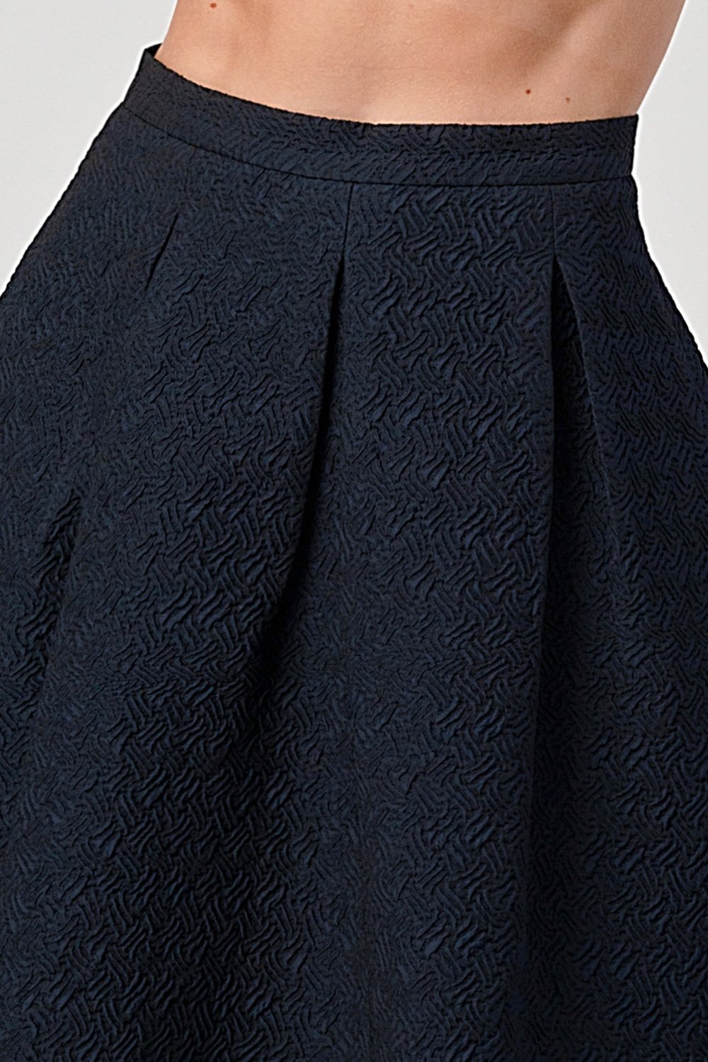 A stylish Pleated Waist Mid-Length Puffy Skirt displayed on a model, showcasing its elegant pleats and puffy silhouette.