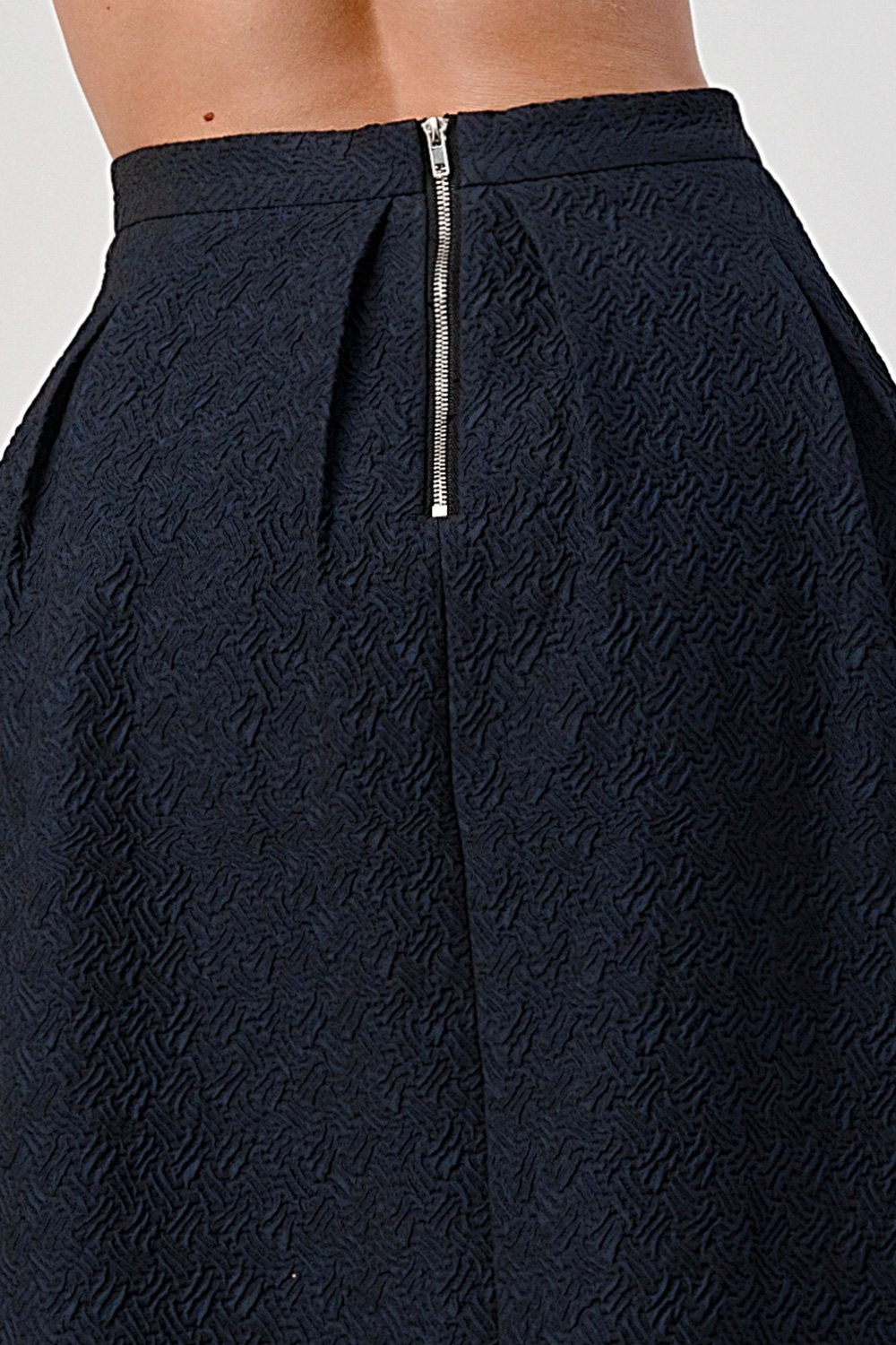 A stylish Pleated Waist Mid-Length Puffy Skirt displayed on a model, showcasing its elegant pleats and puffy silhouette.