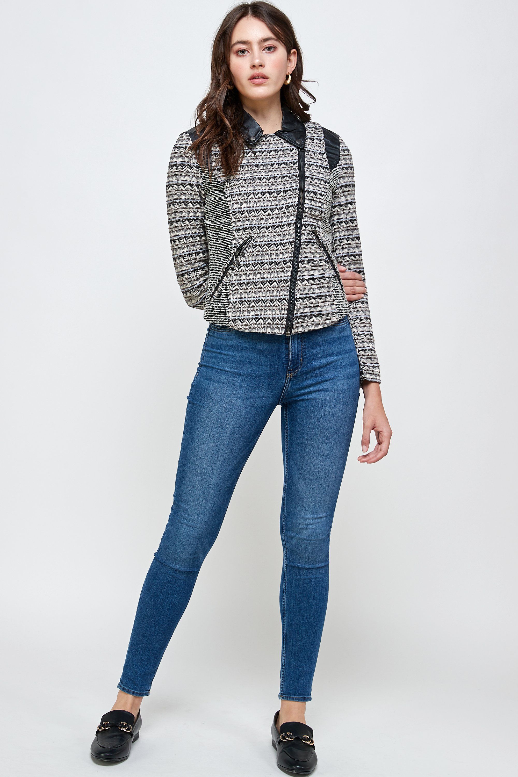 A stylish Jacquard Biker Jacket Top displayed on a mannequin, showcasing its intricate fabric design and tailored fit.