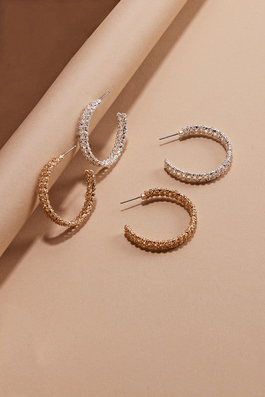Stylish textured round shaped hoop earrings with a 1.25 inch drop length, perfect for daily wear.