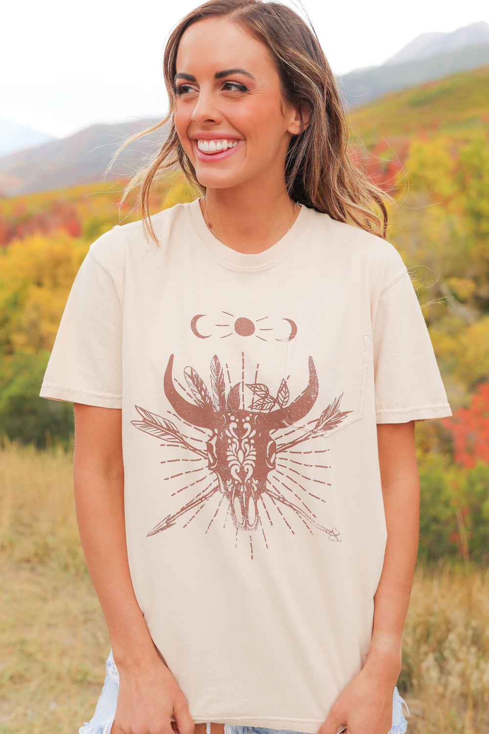 The Cosmic Bull upcycled cotton shirt in ivory, showcasing its stylish design and eco-friendly fabric.