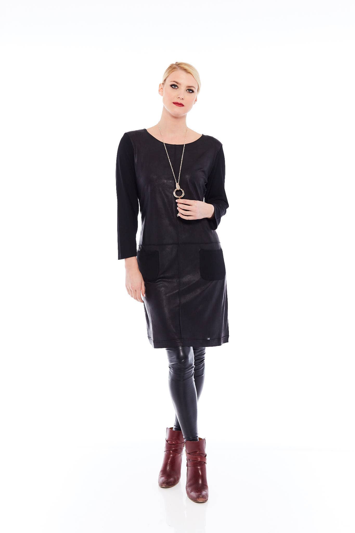 The Feel Good Dress in Matte Black featuring a soft fabric, long sleeves, and a stylish cowl neck, perfect for various occasions.