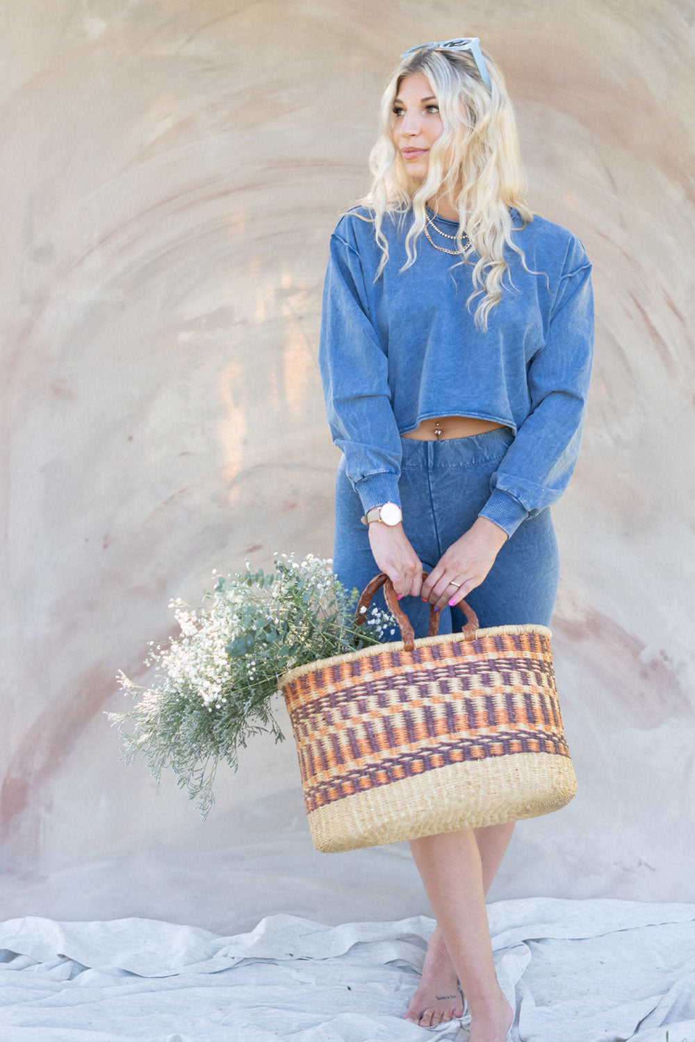 The Happiness Sweatshirt in washed black, showcasing its soft fabric and flattering fit, perfect for casual outings.