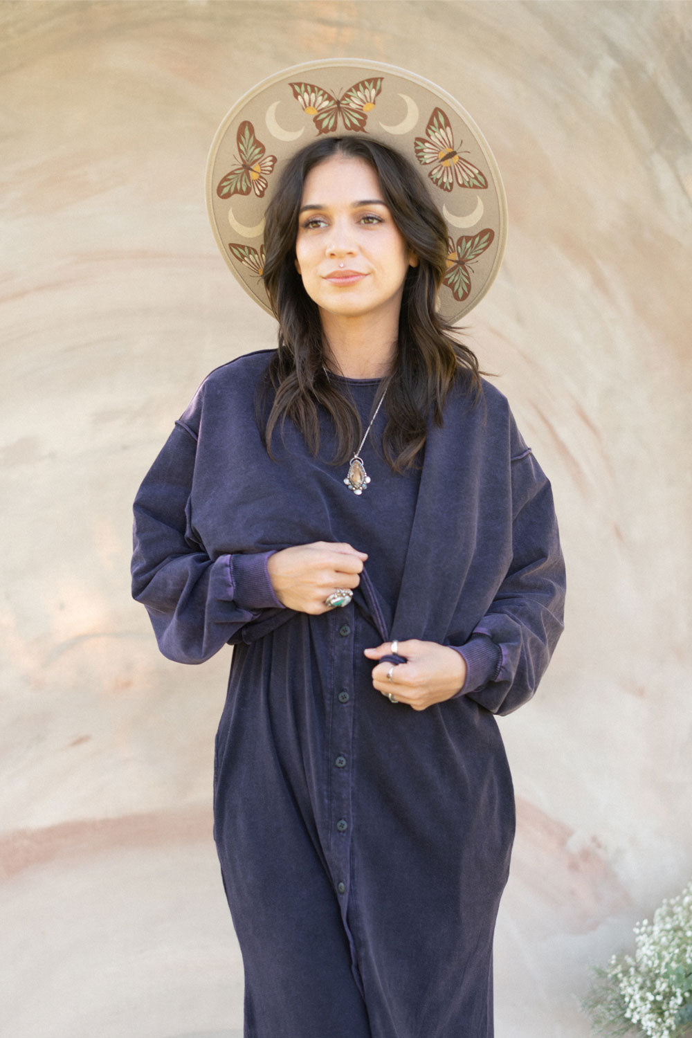 The Happiness Sweatshirt in washed black, showcasing its soft fabric and flattering fit, perfect for casual outings.