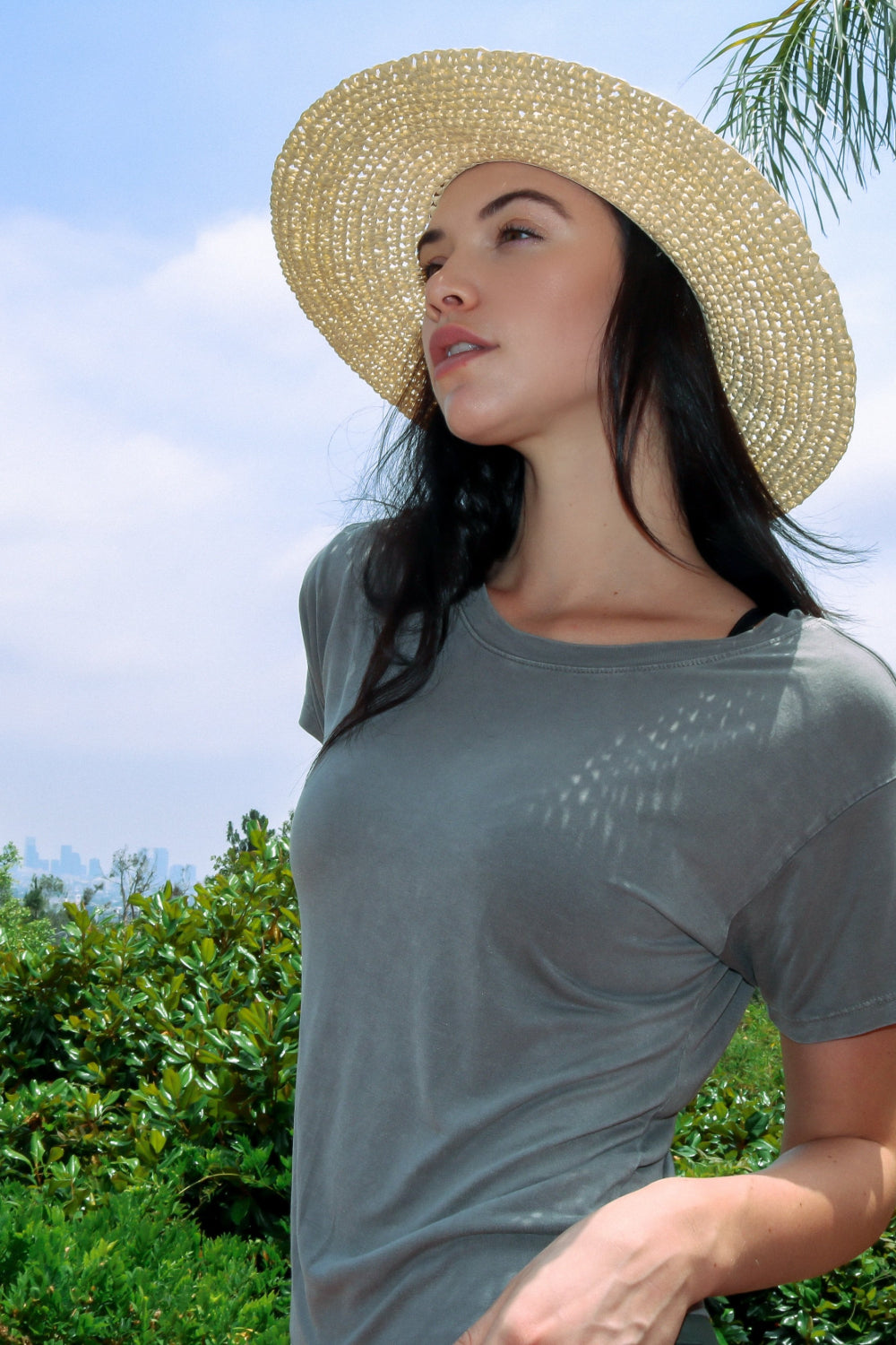The Original Tee in Charcoal color, showcasing its lightweight fabric and relaxed fit, perfect for summer wear.
