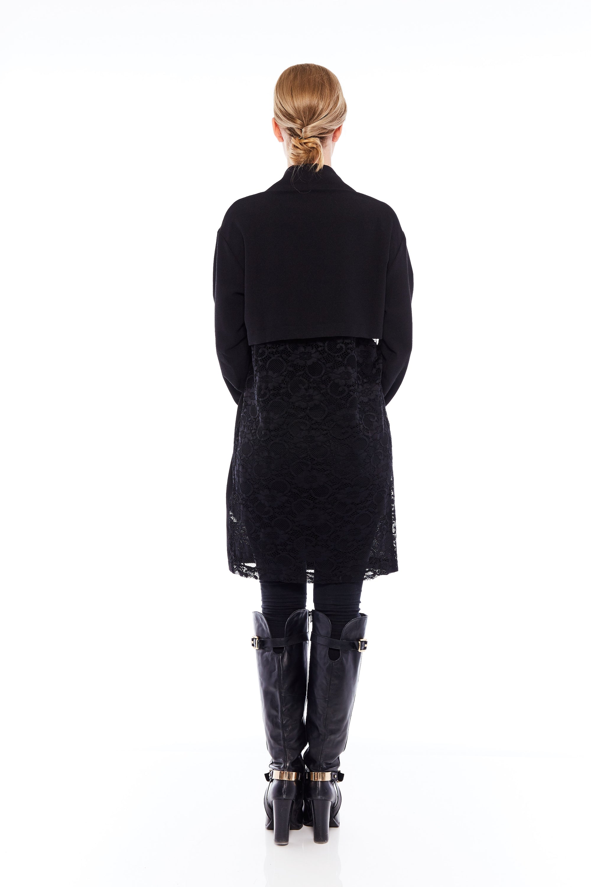 The Tailored Iconic Jacket in Midnight Black featuring stylish side pockets and a flared design, perfect for chic and cozy looks.