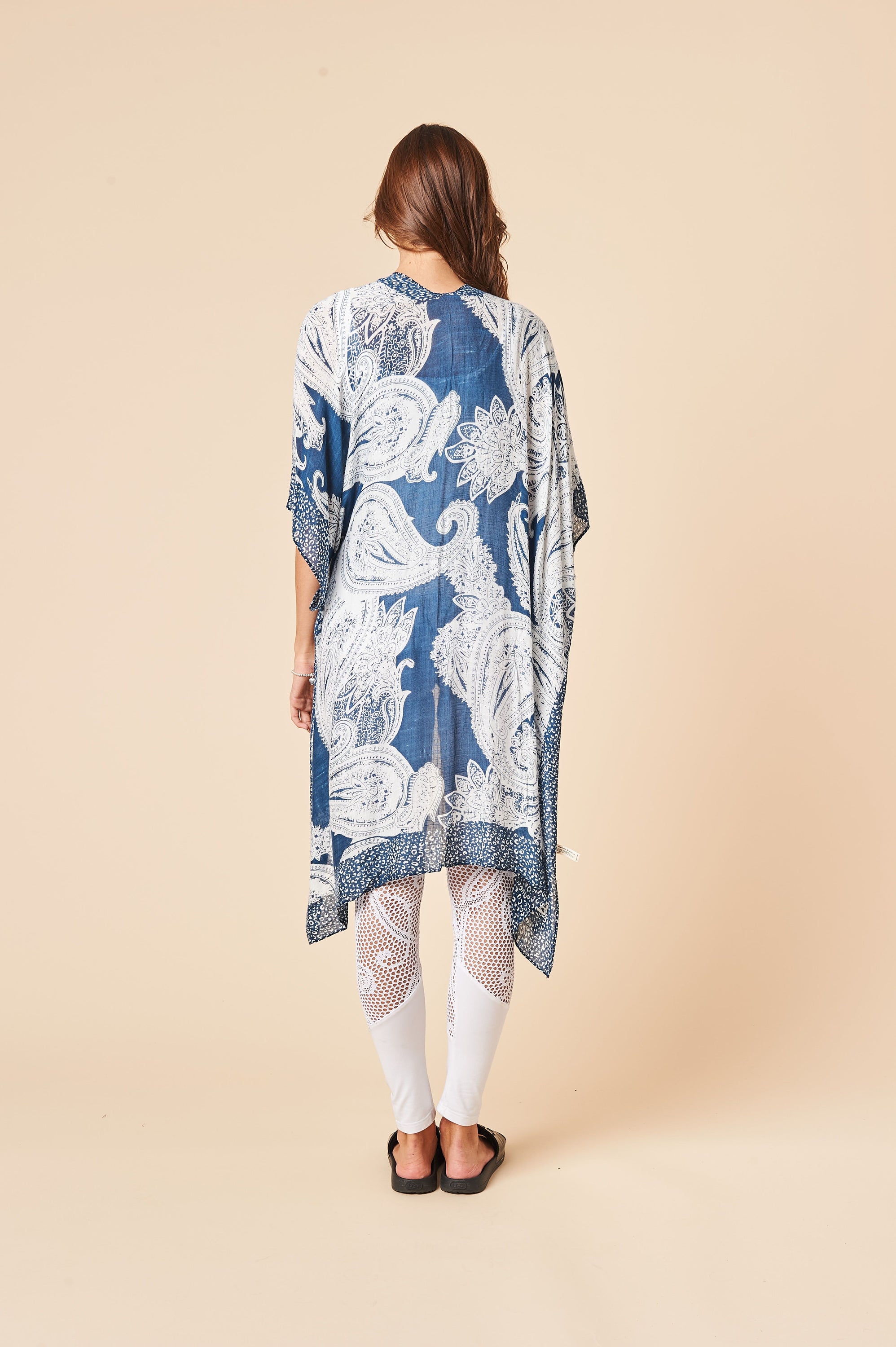 A stylish mid-weight kimono in whitish blue, featuring side slits and a soft viscose blend fabric, perfect for layering or lounging.