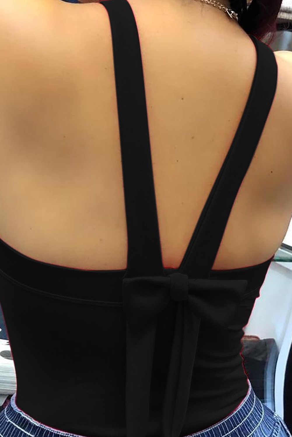 A stylish Thick Strap Backless Bowknot Tank Top featuring a hollow-out bowknot design, perfect for summer fashion.