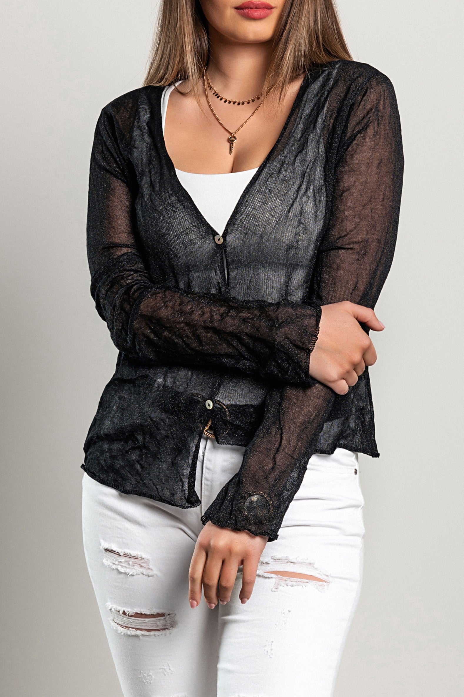 A stylish black thin cardigan with buttons, featuring long sleeves and an asymmetrical cut, perfect for layering.