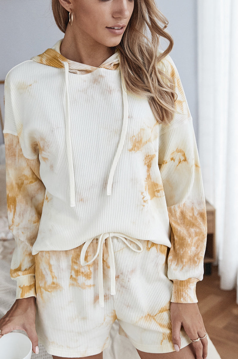 A stylish tie dye hoodie and shorts lounge set featuring a long sleeve hoodie and high waist shorts, perfect for casual wear.