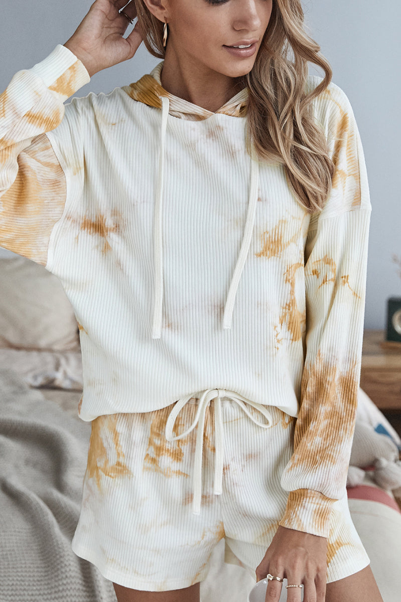A stylish tie dye hoodie and shorts lounge set featuring a long sleeve hoodie and high waist shorts, perfect for casual wear.