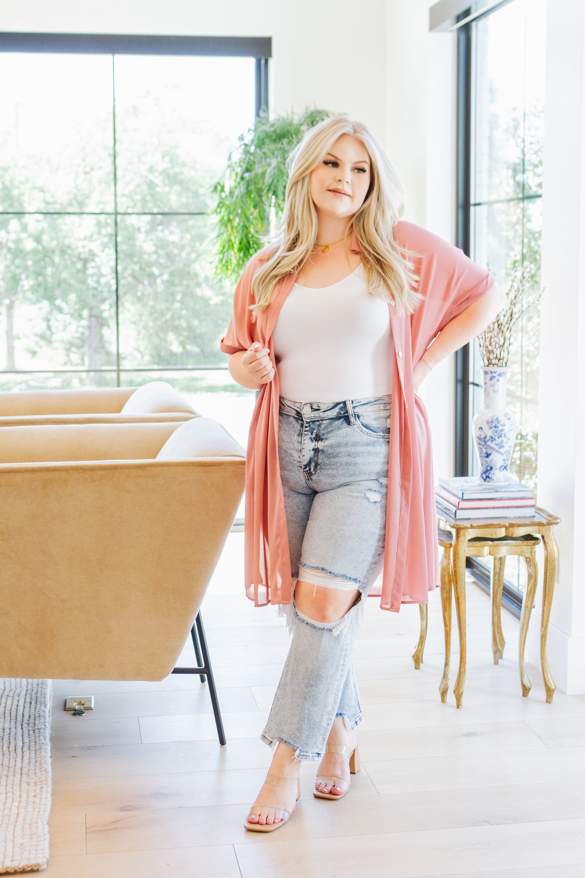 A stylish Timeless Appeal Shirtdress in sheer poly chiffon, featuring a collared design, button front, and side slits, perfect for any occasion.