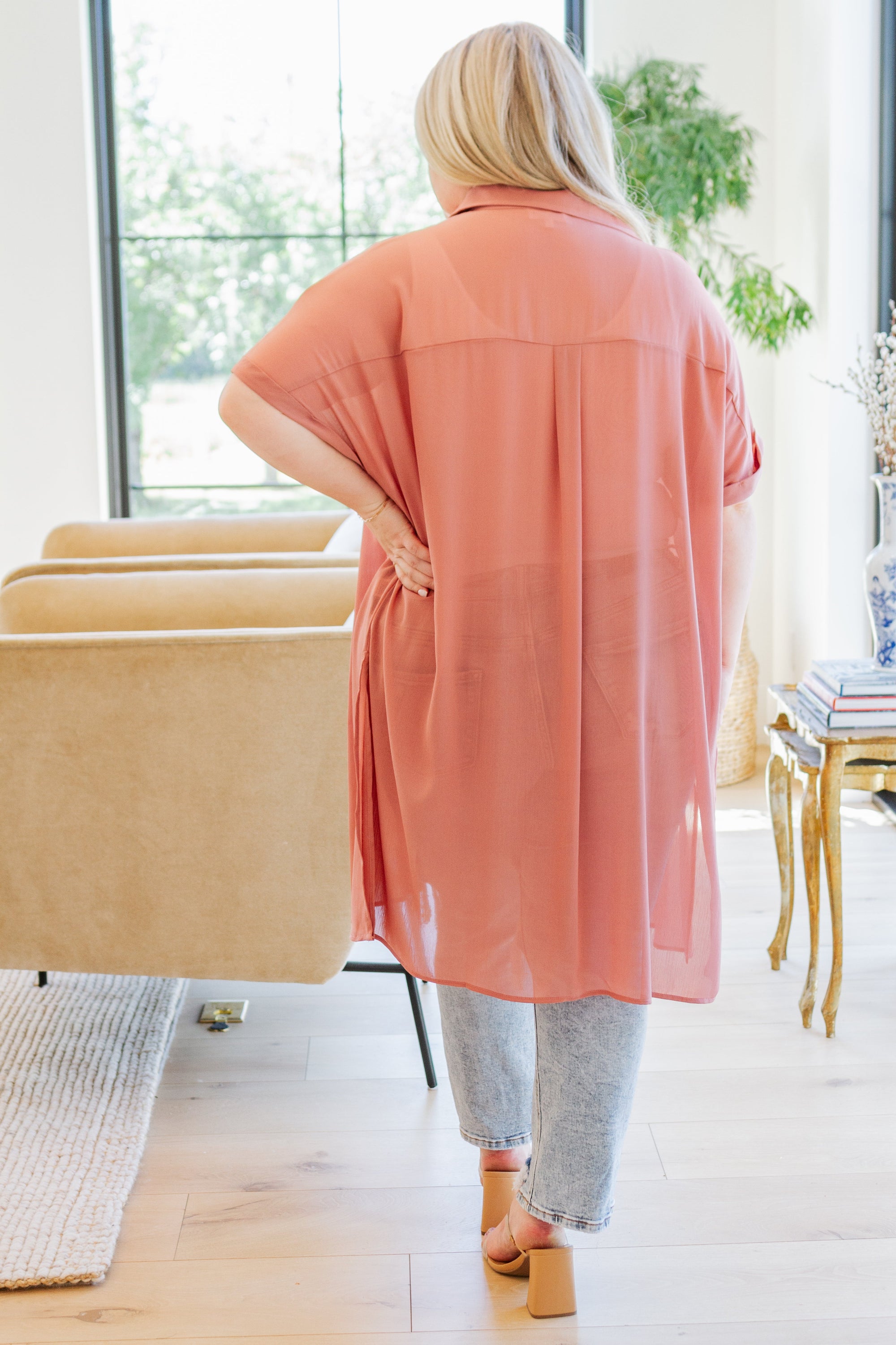 A stylish Timeless Appeal Shirtdress in sheer poly chiffon, featuring a collared design, button front, and side slits, perfect for any occasion.