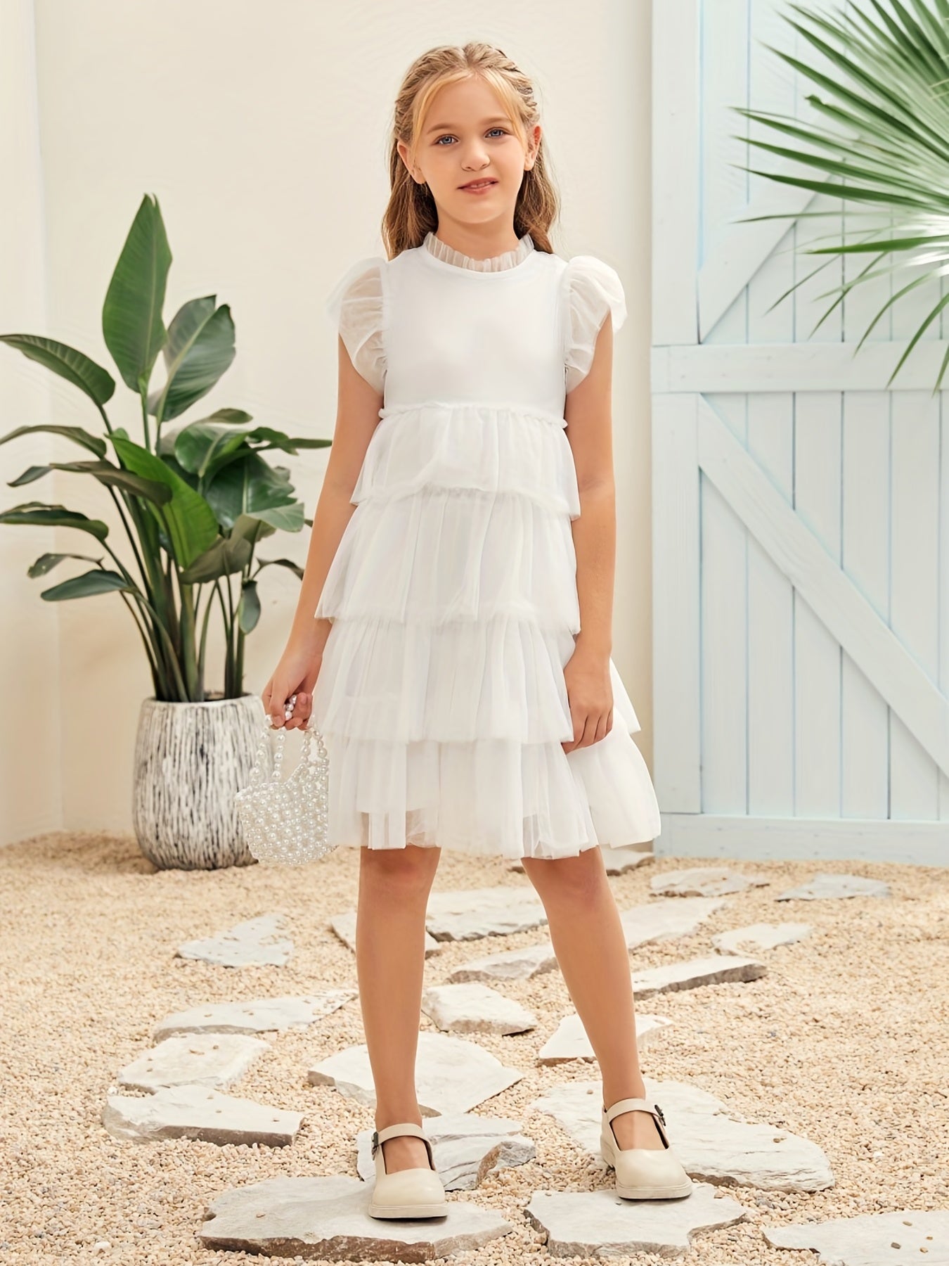 Toddler girls' elegant flutter sleeve dress with layered hem, made from soft cotton blend fabric, perfect for special occasions.