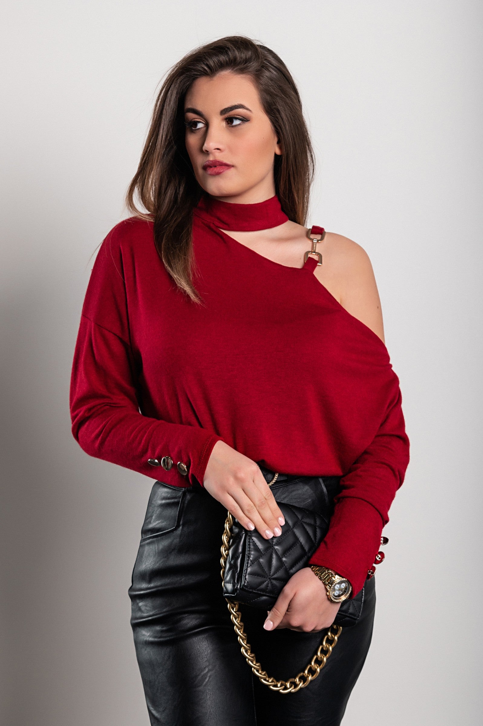 Burgundy Mirabelle top featuring an asymmetrical neckline and long sleeves with decorative buttons, made in Italy.