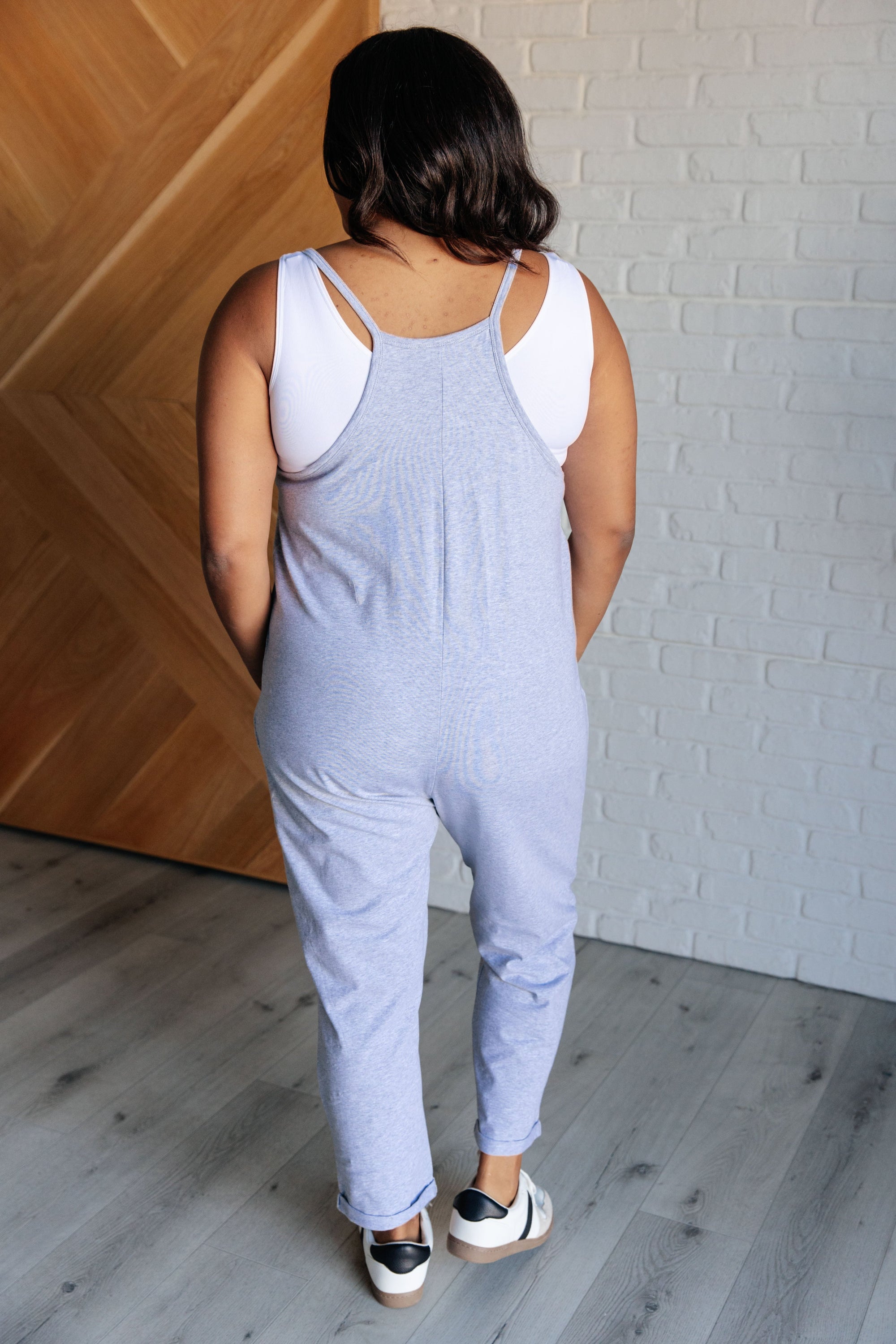 Totally Me Spaghetti Strap Jumpsuit in Heather Grey, featuring a scooped neckline, spaghetti straps, and functional patch pockets.