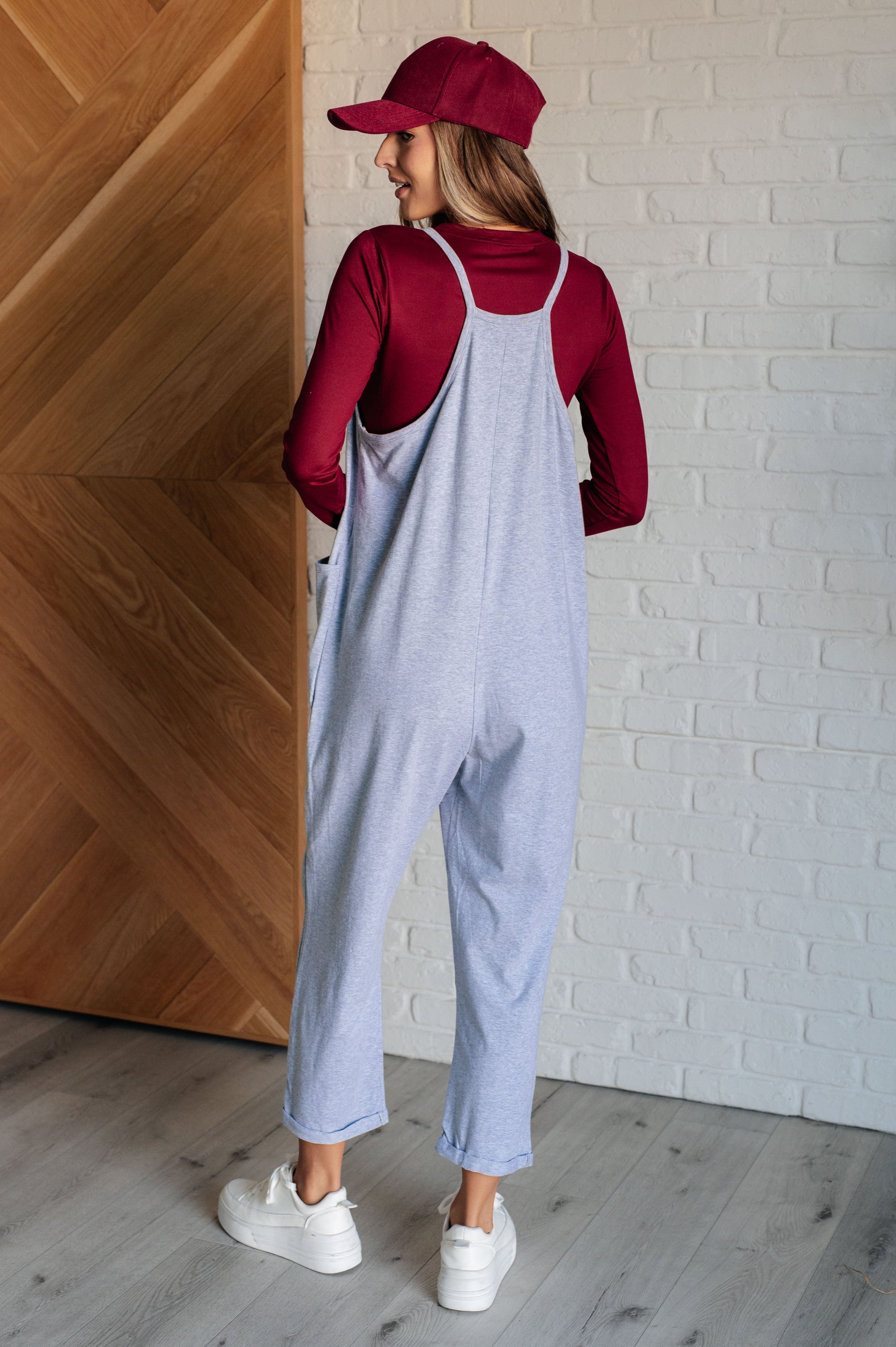 Totally Me Spaghetti Strap Jumpsuit in Heather Grey, featuring a scooped neckline, spaghetti straps, and functional patch pockets.