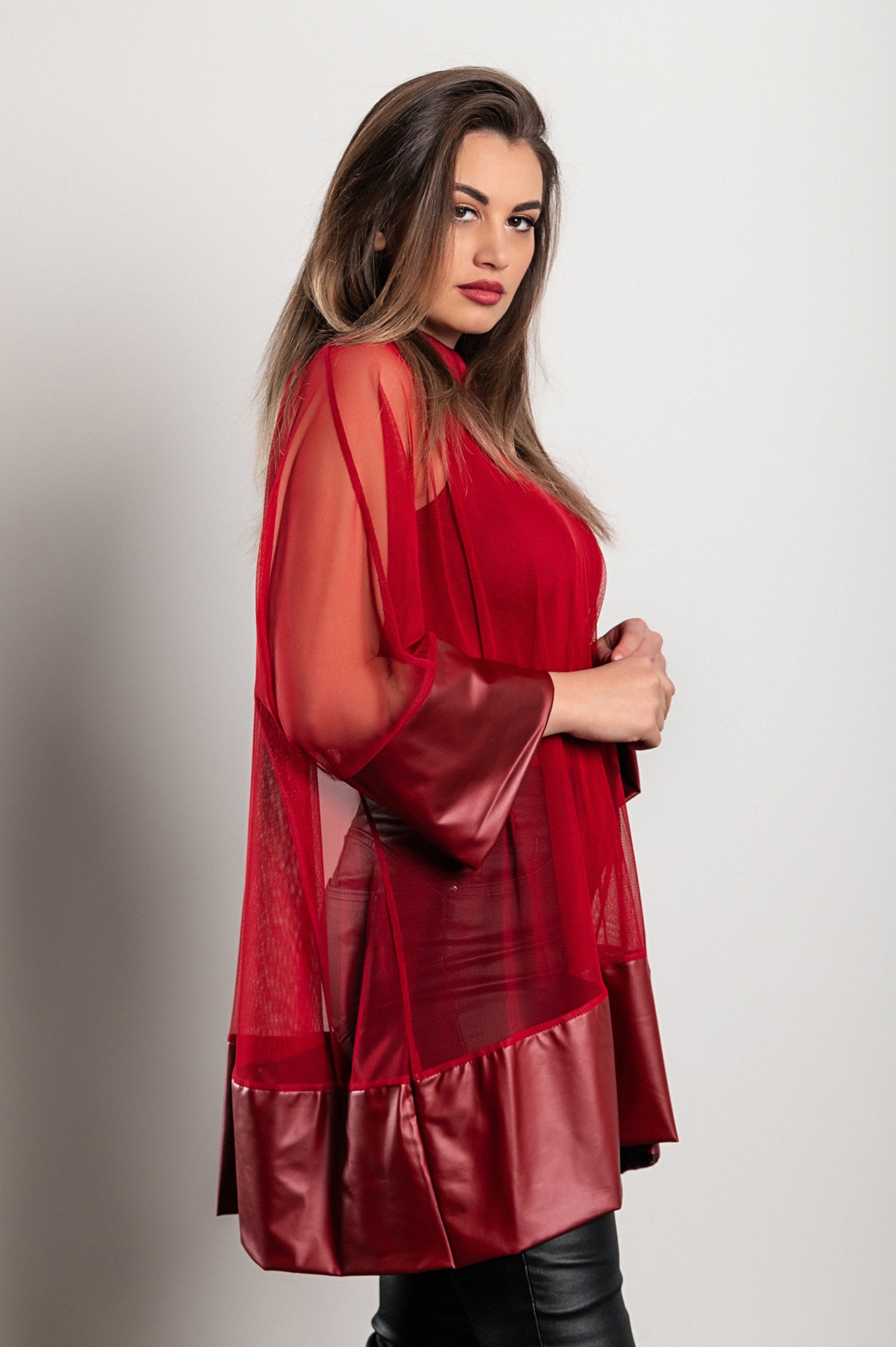 Burgundy transparent tunic featuring artificial leather and faux fur sleeves, stylish and loose-fitting design.