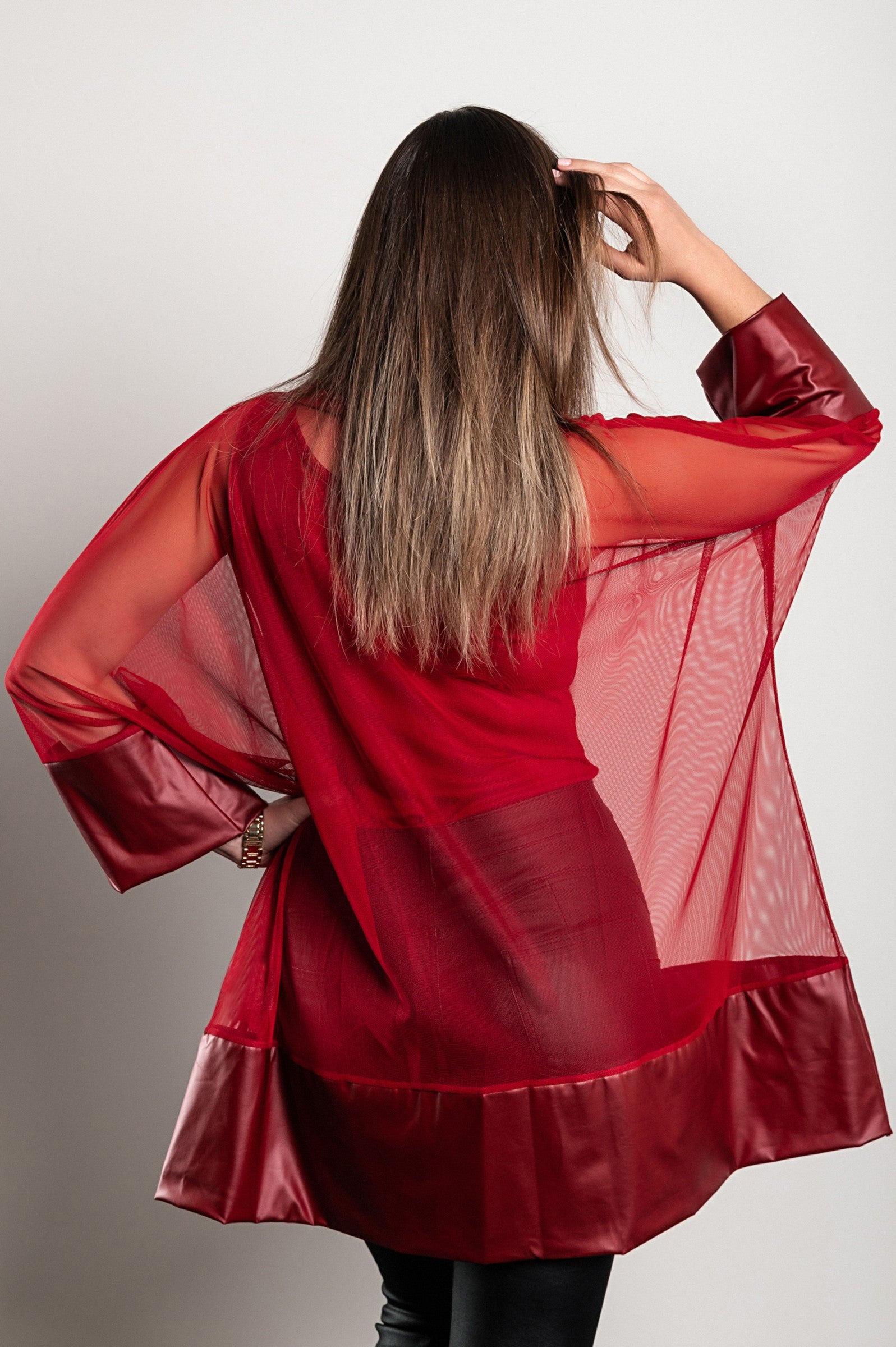 Burgundy transparent tunic featuring artificial leather and faux fur sleeves, stylish and loose-fitting design.