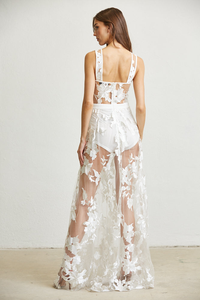 A beautiful floral embroidered prom dress featuring a corset waist, thick shoulder straps, and a zipper back closure, perfect for special occasions.