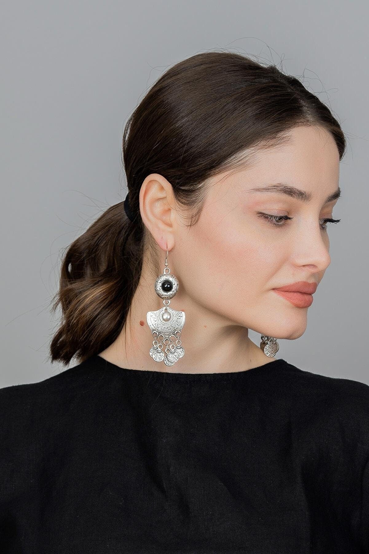 A pair of antique silver plated Tribal Goddess Earrings designed for bellydance, featuring intricate detailing and a lightweight design.