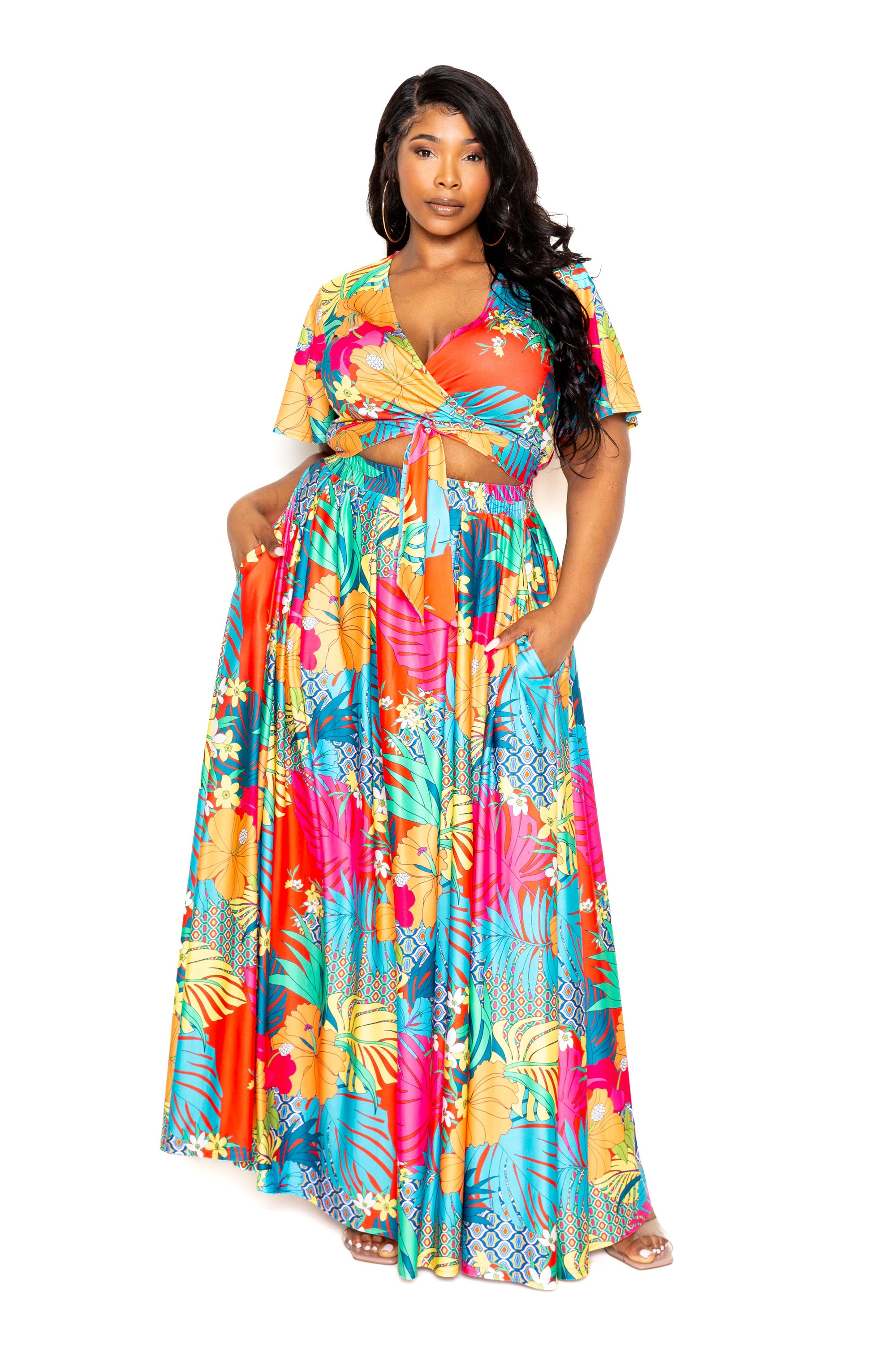A vibrant tropical floral maxi skirt and top set, showcasing a colorful floral pattern perfect for summer occasions.