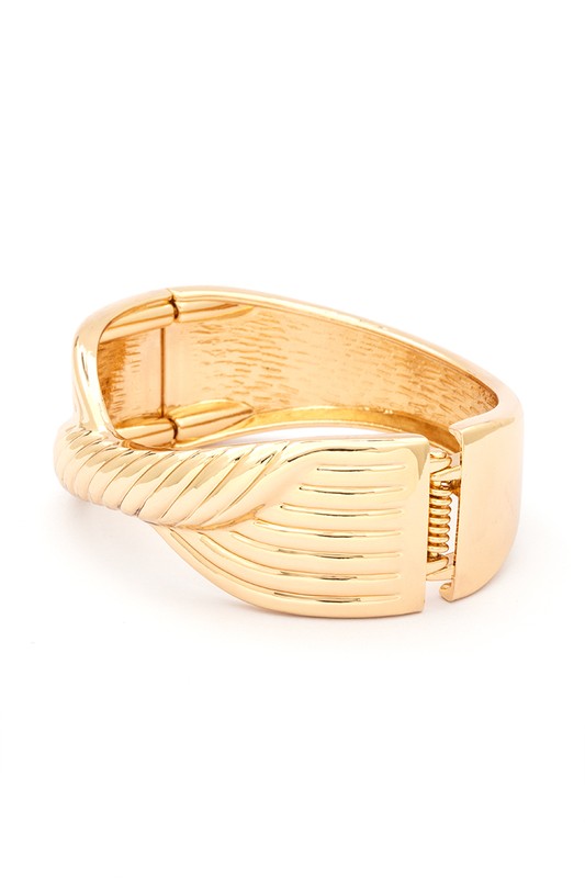 Twisted Designed Hinged Bangle in 18 KT gold plating with a unique twisted pattern and spring hinged closure.
