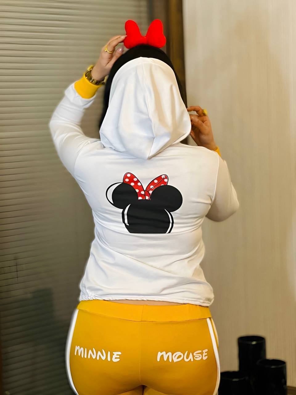 Two-piece set featuring a Minnie Mouse long sleeve hoodie and matching shorts, perfect for young Disney fans.