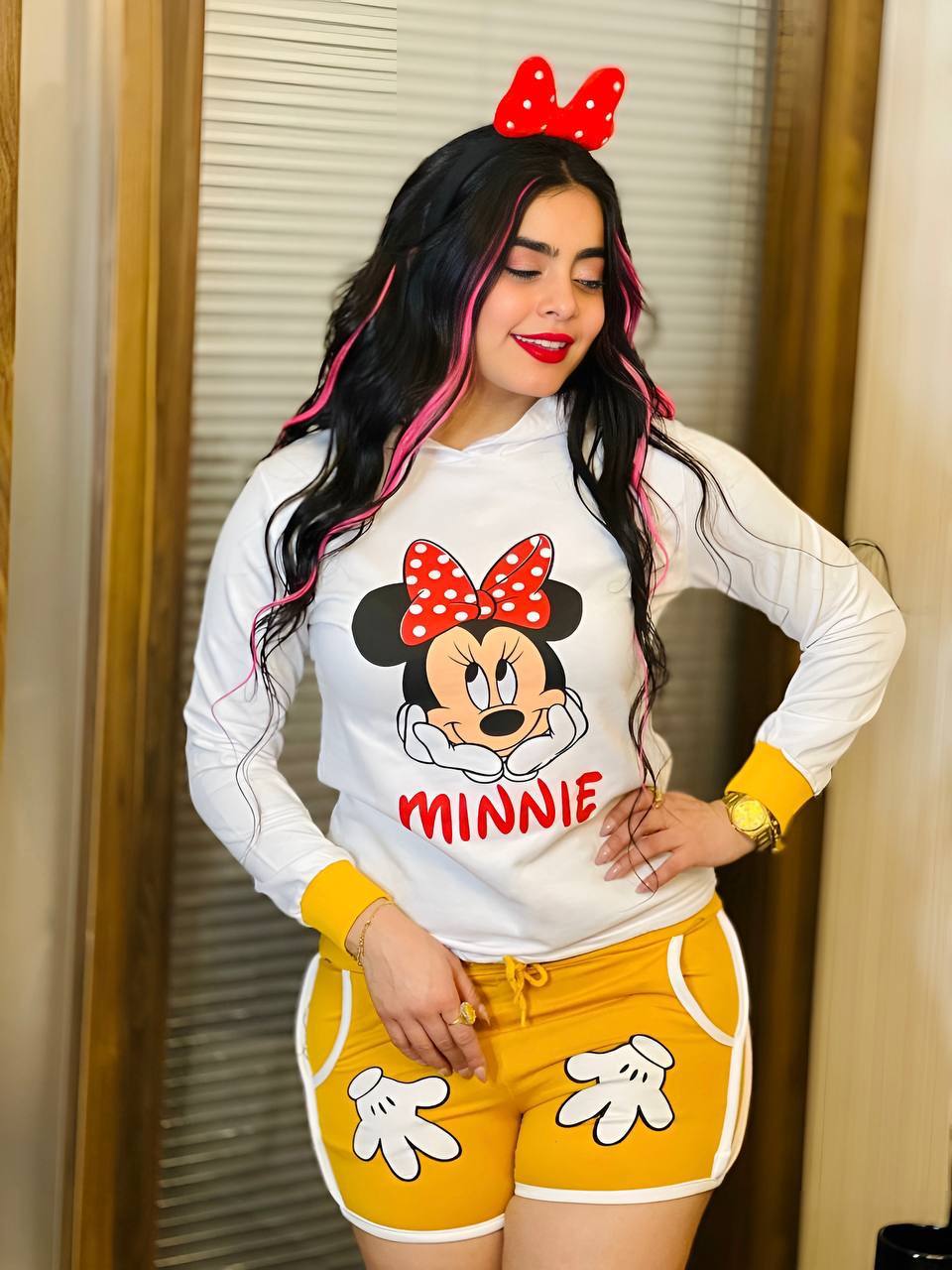 Two-piece set featuring a Minnie Mouse long sleeve hoodie and matching shorts, perfect for young Disney fans.