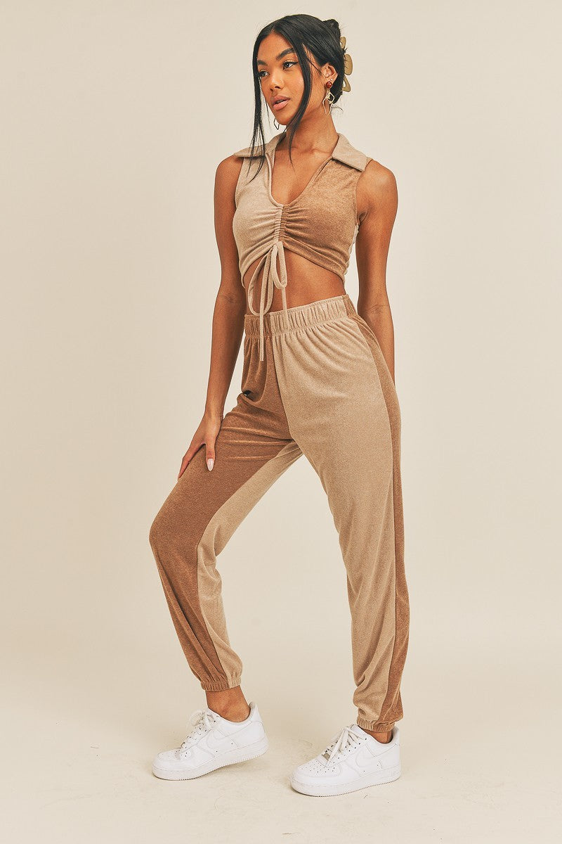 Two-tone color two-piece set featuring a V-neck polo and high-rise joggers in camel and taupe.