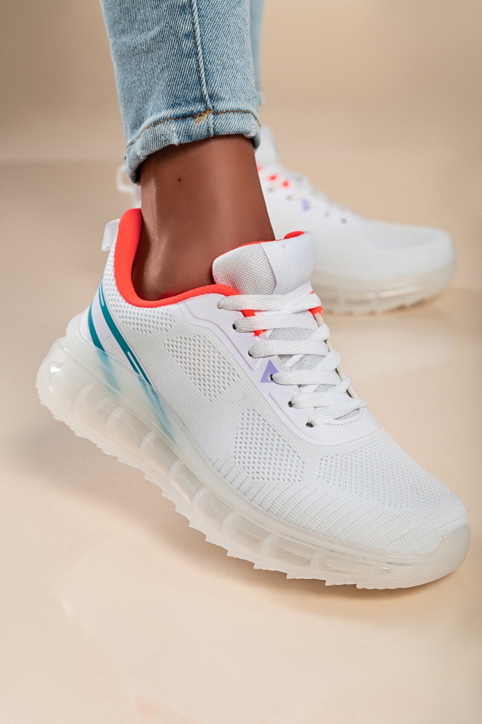 Stylish two-tone combination sneakers in white with a textile upper, round toe, and lace-up closure, featuring reinforced heel and toe.