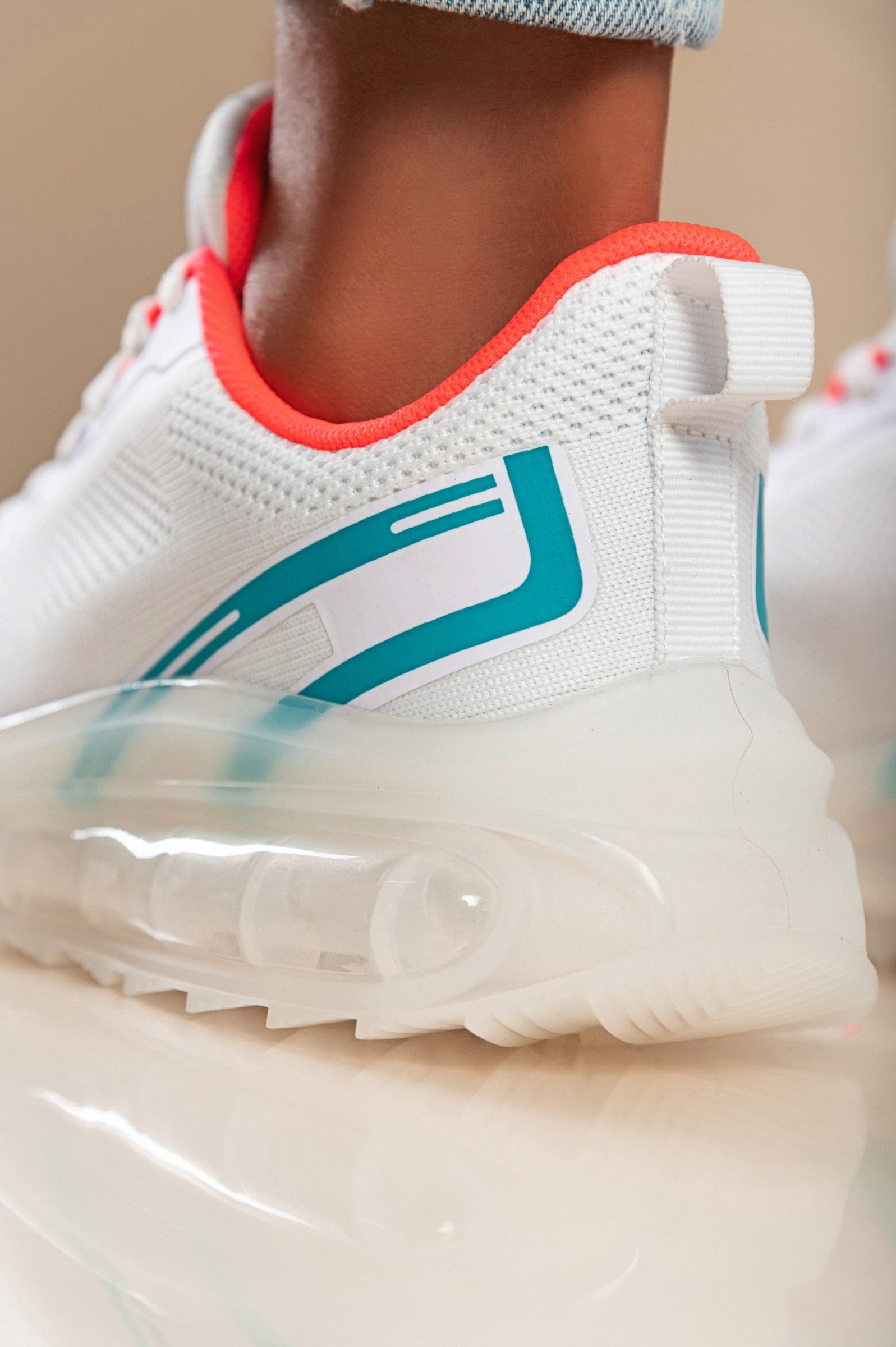 Stylish two-tone combination sneakers in white with a textile upper, round toe, and lace-up closure, featuring reinforced heel and toe.