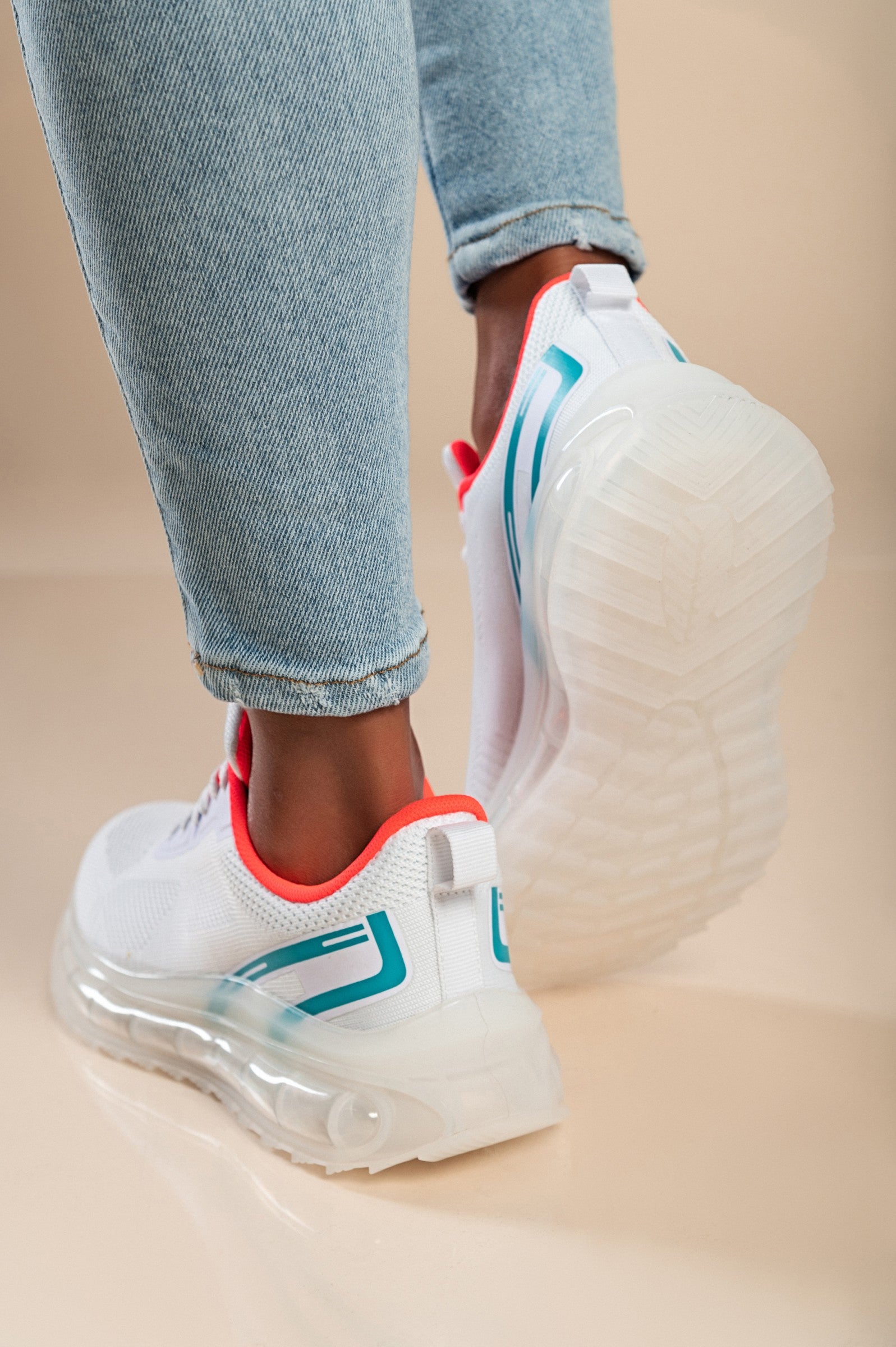 Stylish two-tone combination sneakers in white with a textile upper, round toe, and lace-up closure, featuring reinforced heel and toe.