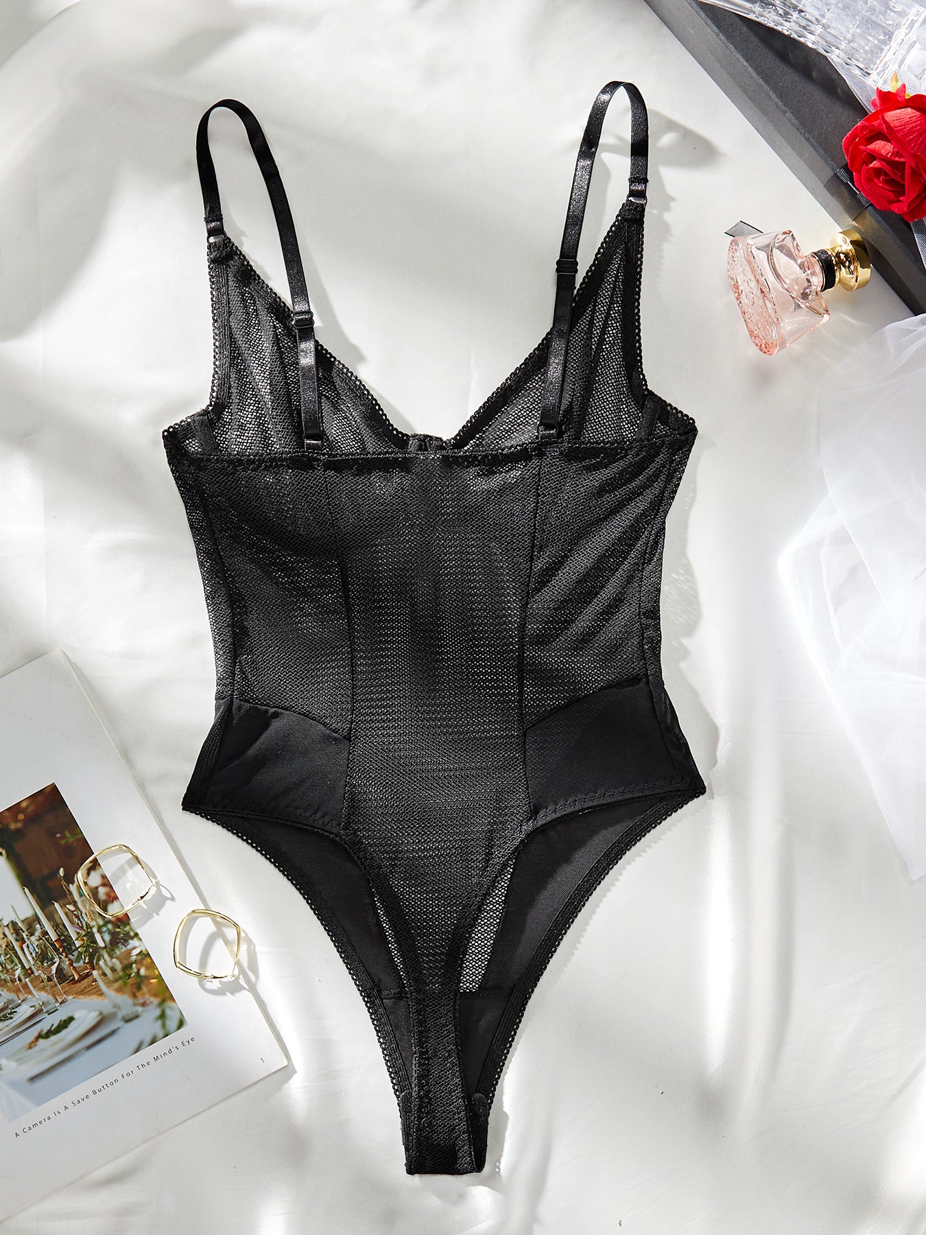 A sexy sleeveless mesh bodysuit featuring lace and tulle splicing, perfect for summer wear.