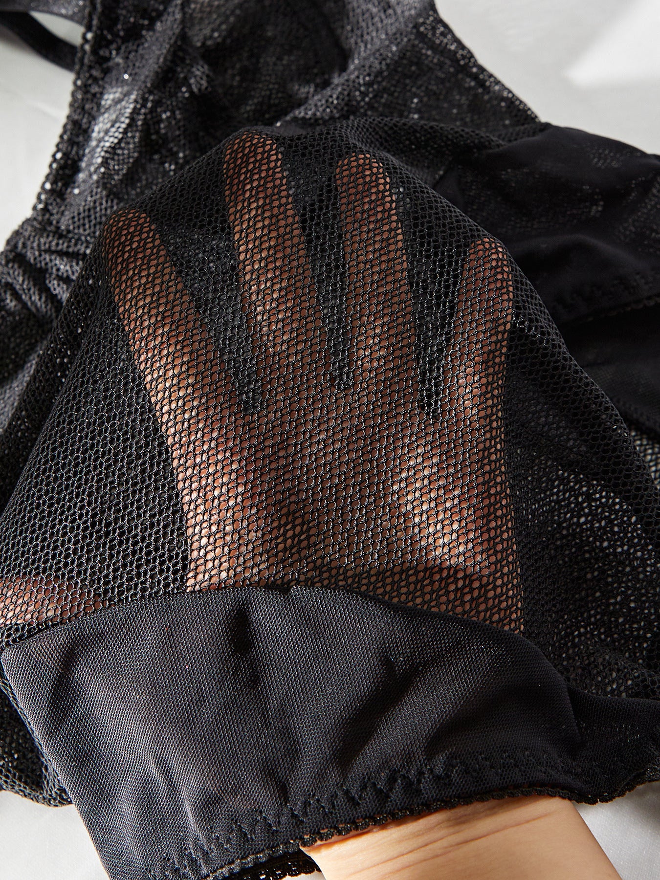 A sexy sleeveless mesh bodysuit featuring lace and tulle splicing, perfect for summer wear.