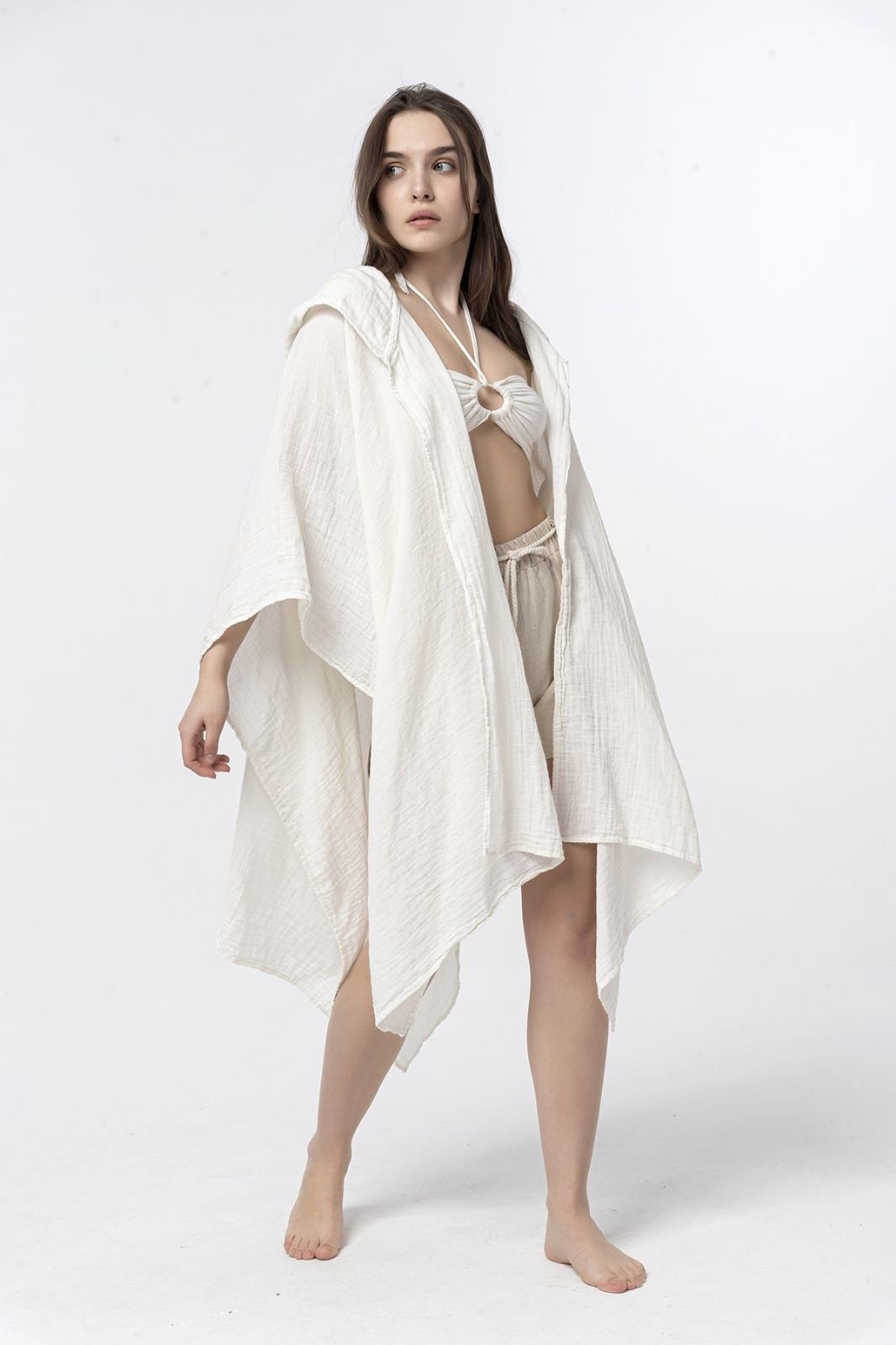 A soft and stylish unisex cotton hooded cloak kaftan, perfect for meditation and relaxation, featuring a natural fabric and a comfortable fit.
