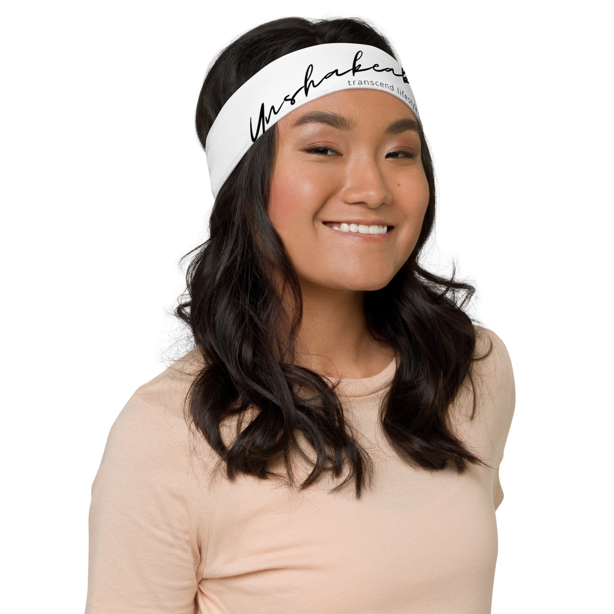 A soft and stretchy Unshakeable Headband in various colors, designed for workouts and casual wear.
