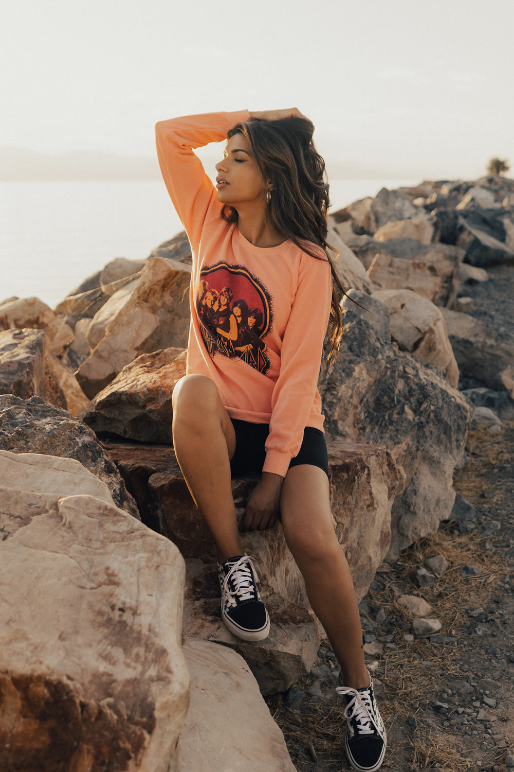 Upcycle Def Leppard School Sweater in peach color, featuring the iconic band logo, made from 100% cotton with eco-friendly dye.